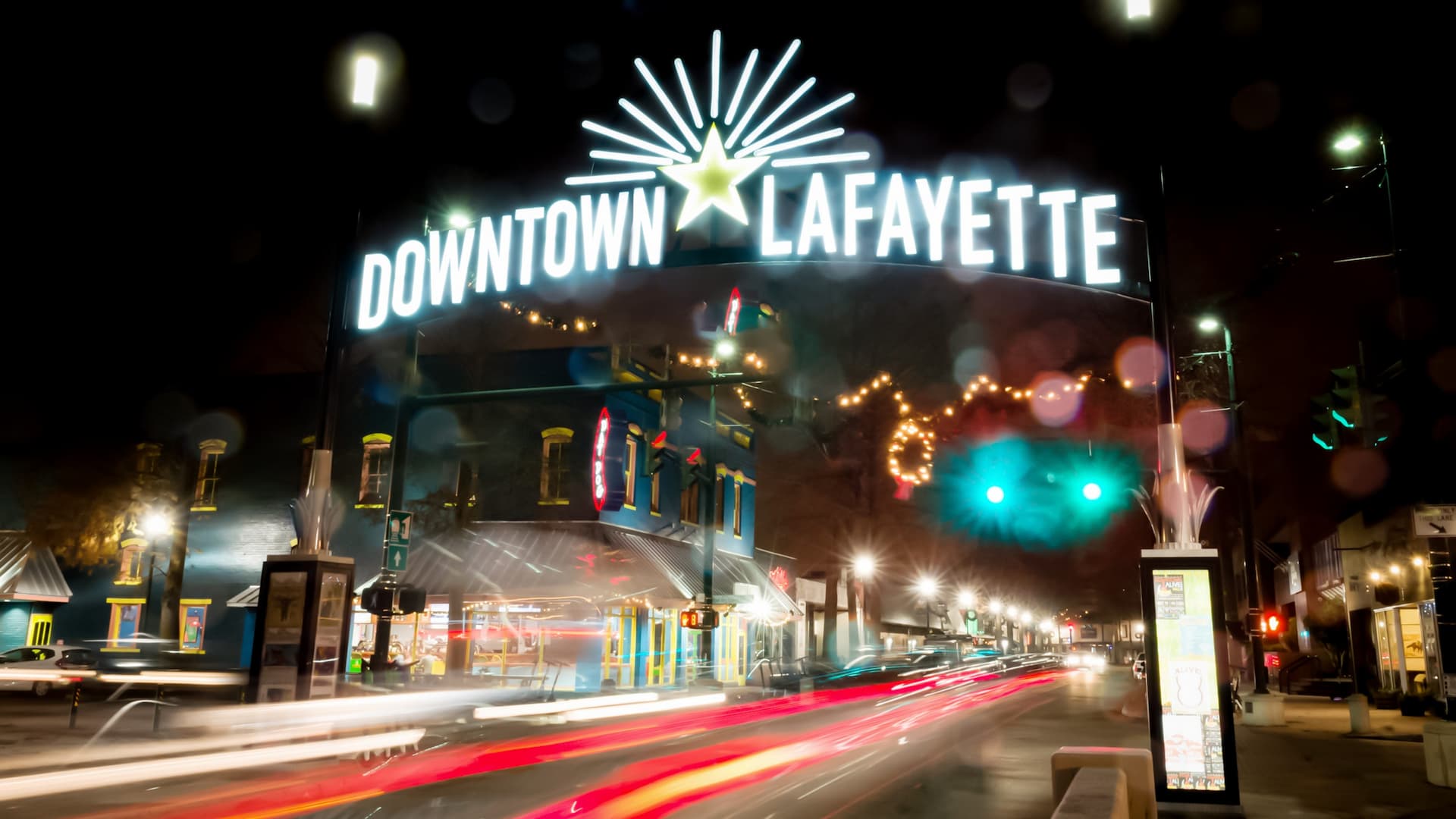 Lafayette downtown sign lit up at night, hazy background